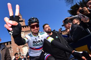 Peter Sagan waves to the crowds at the start