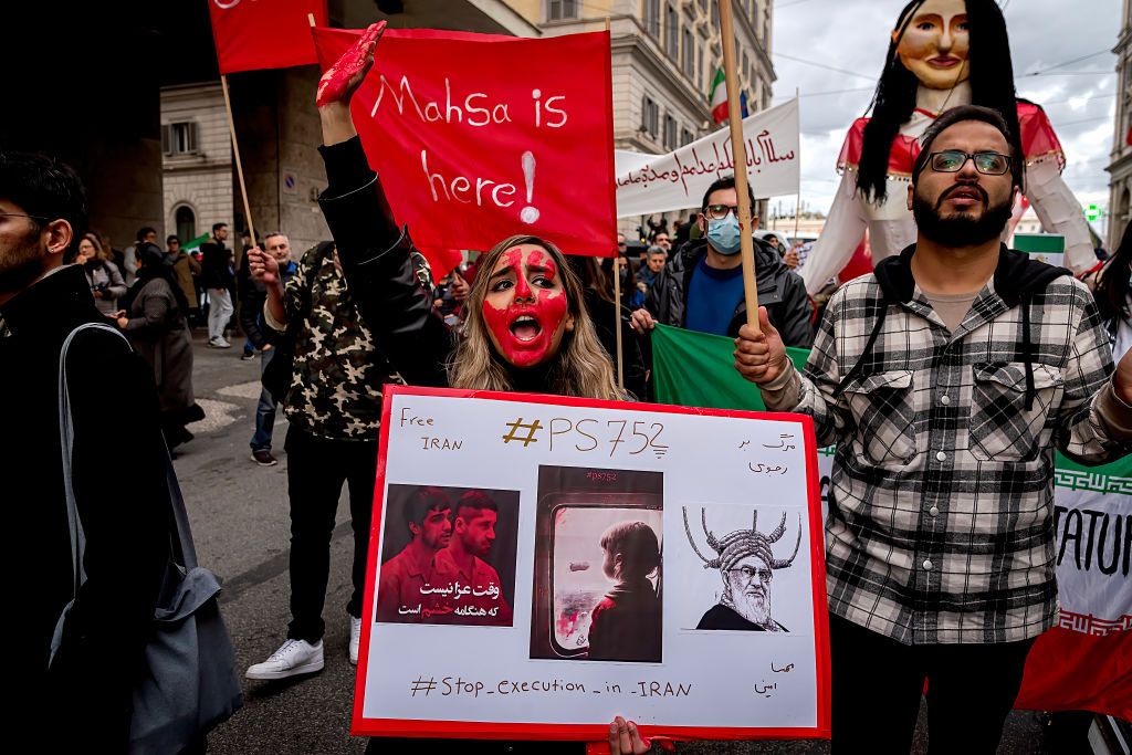 ROME, ITALY - JANUARY 08: People in support of the Iranian community take part in the &quot;Woman, Life, Freedom&quot; demonstration against the Iranian regime on January 8, 2023 in Rome, Italy. The mobilization is to express the growing concern about the executions, new death sentences and arrests of young protesters that have been taking place in recent weeks in Iran.