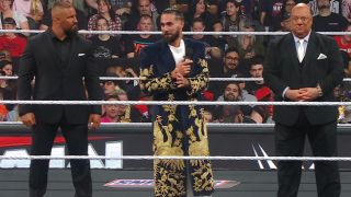 Seth Rollins flanked by Bron Breakker and Paul Heyman