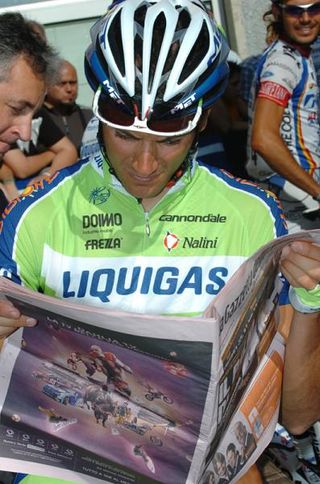 Italy's Ivan Basso catches up on the news.