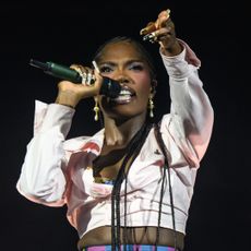 Doechii closed her Glastonbury performance in a custom Vivienne Westwood outfit inspired by the Spring 1994 "Cafe Society" collection.