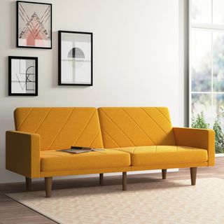 A yellow sofa bed that folds down