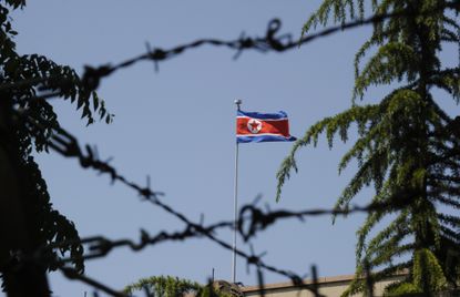 The North Korean flag flies over the embassy in Beijing