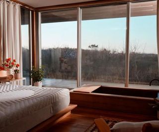 A Casper mattress in a room with a mountain view.