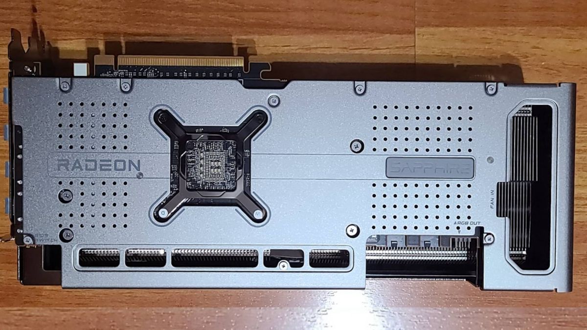 AMD Radeon RX 7900 graphics card with back facing camera on wood surface
