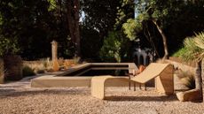 Rattan chairs by Gubi and Bonacina photographed poolside in a garden