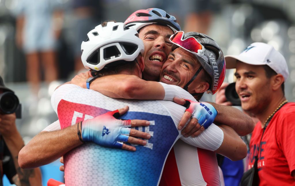 PARIS FRANCE AUGUST 03 LR Silver medalist Valentin Madouas of Team France Bronze medalist Christophe Laporte of Team France and Julian Alaphilippe of Team France celebrate at finish line during the Mens Road Race on day eight of the Olympic Games Paris 2024 at trocadero on August 03 2024 in Paris France Photo by Jared C TiltonGetty Images