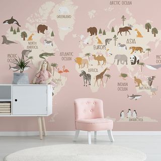 girls nursery with pink world mural and pink chair