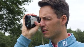 Joel Tadman testing the Nikon Coolshot 50i rangefinder