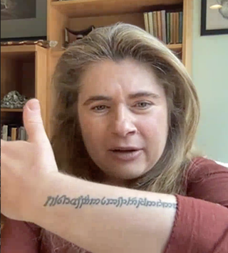 NASA astronomer Michelle Thaller shows off her elvish tattoos.
