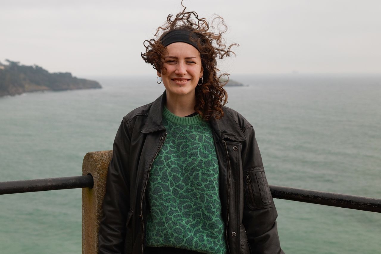 A photo of a woman smiling, taken on a Sigma BF camera