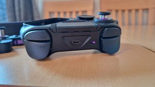 Victrix Pro BFG review image showing the top of the gamepad with bumpers and triggers, as well as the USB-C slot and platform switch for pairing to a console or PC
