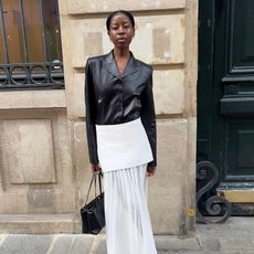 Fashion influencer @sylviemus_ in Europe wearing a chic outfit for 2025 styled with a blazer.