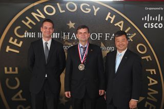 (L to R) NASA representative Daniel Lockney; DLR inductee, Ekkehard Kuehrt, asteroids and comets department head, Institute of Planetary Research; and Space Foundation Special Adviser - Human Spaceflight, former NASA astronaut Leroy Chiao.