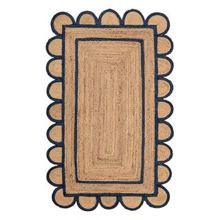 Scalloped jute rug with dark blue trim