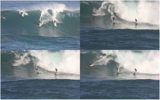 An image of surfers surfing a wave.