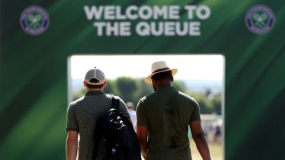 Spectators join the queue on day one of The Championships Wimbledon 2025 at All England Lawn Tennis and Croquet Club 