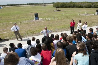 NASA Administrator Charlie Bolden talks to about 50 eighth-grade students from McNair Magnet Middle School in Rockledge, Fla., and other invited guests who are at Kennedy Space Center in Florida to watch shuttle Discovery return from space for the last ti