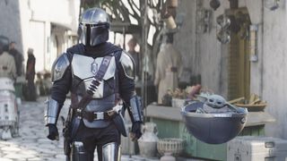 (L-R): Din Djarin (Pedro Pascal) and Grogu in Lucasfilm's THE MANDALORIAN, season 3