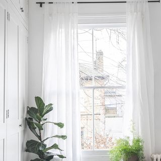 sheer white linen curtains in bedroom