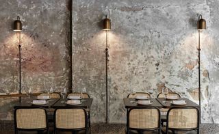 Bronze wall lights and oak tables and chairs at Pentolina restaurant, Melbourne, Australia