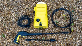A Karcher K2 Pressure washer on some gravel 