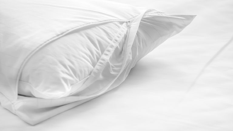 White oxford pillowcase cover being put on a pillow