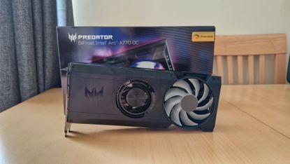 Acer Predator BiFrost Intel Arc A770 reviw image showing the card sitting diagonally in front of its box