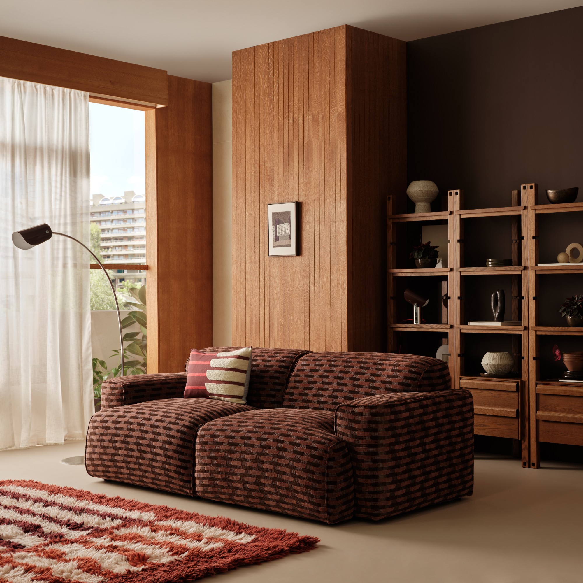 A living room at the Barbican furnished with pieces from the MADE x Barbican homeware collection including the jacquard-pattern Avalon sofa