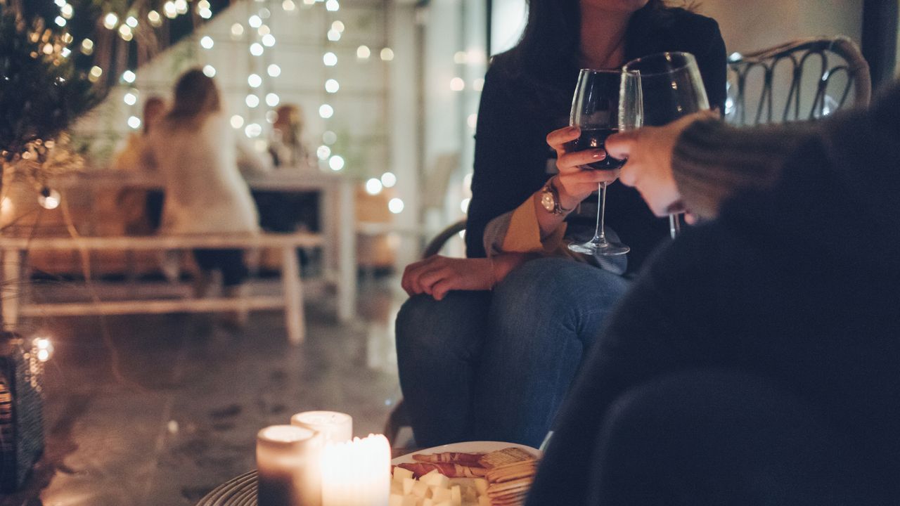 couple toasting with wine during party