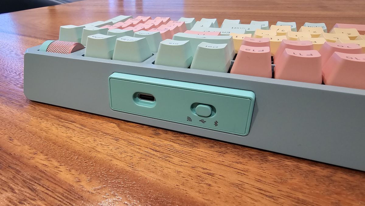 close up of top of Cooler Master MK770 showing USB port and power switch