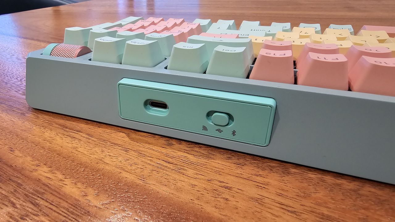 close up of top of Cooler Master MK770 showing USB port and power switch