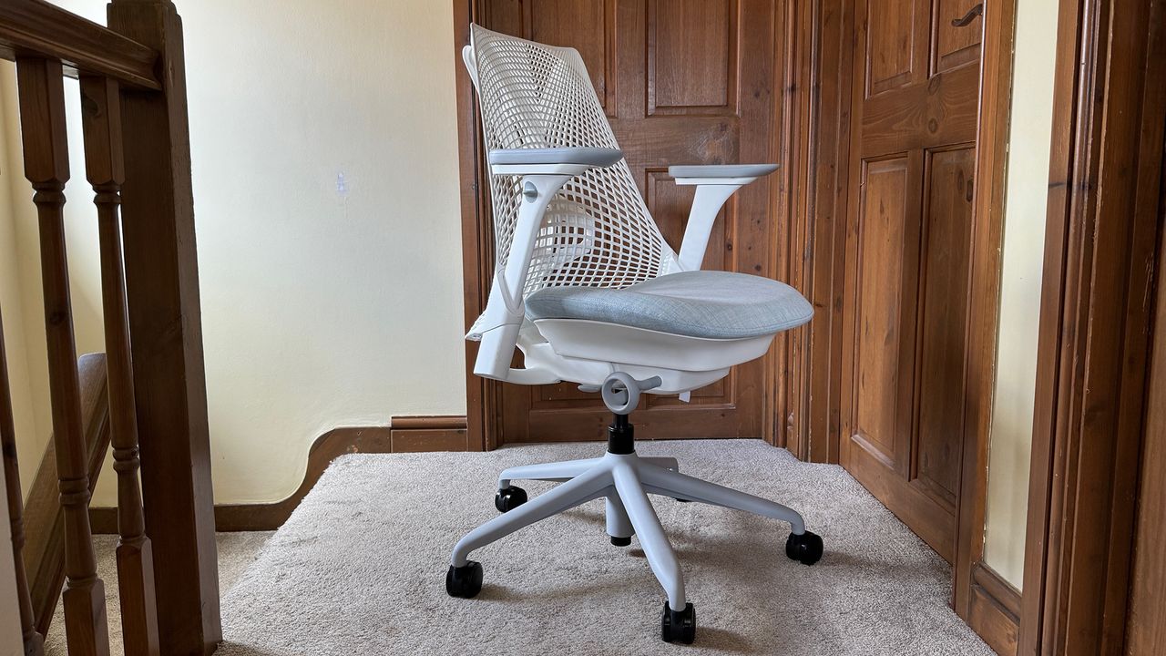 Three different shots of the Sayl chair in a hallway.