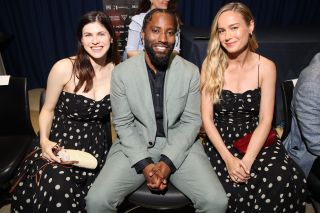Alexandra Daddario, John David Washington and Brie Larson attend the press conference of the Filming Italy 2024 on June 20, 2024 in Cagliari, Italy. Alexandra Daddario and Brie Larson are wearing the same black dress with white polka dots.
