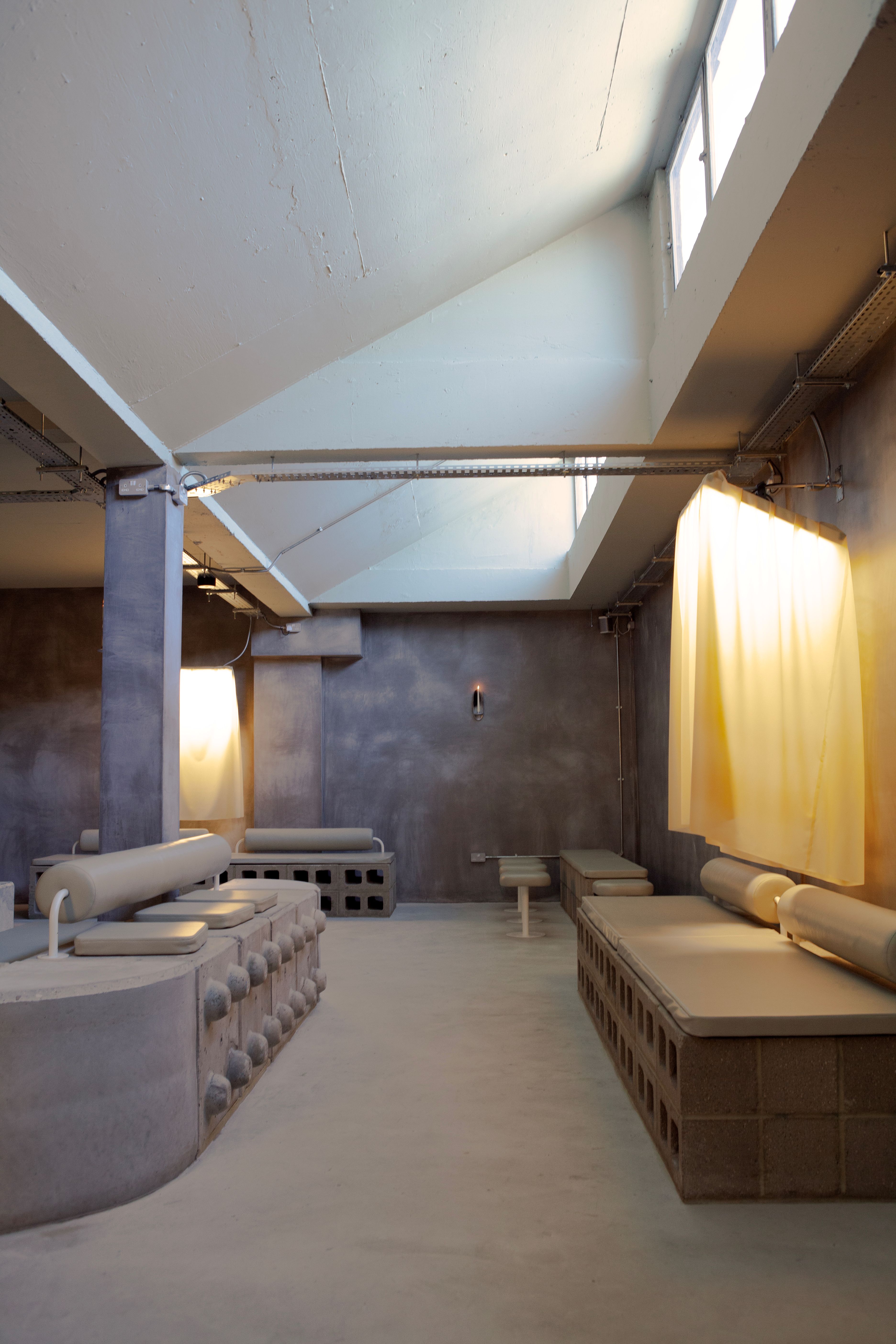 view of a new space in Dalston for intimacy, work and community, where concrete structures sit alongside rubber-cast seating