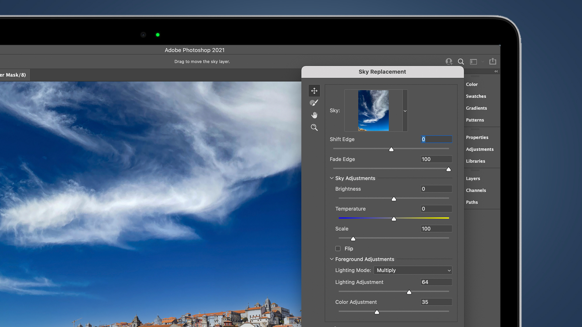 The Photoshop Sky Replacement menu on a laptop screen
