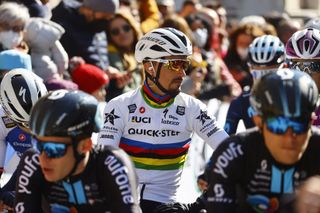 Team Deceunincks Julian Alaphilippe of France C and fellow riders wait prior to take the start of the 6th stage of the Tirreno Adriatico cycling race 215 km from Apecchio to Carpegna Marche region on March 12 2022 Photo by Luca Bettini AFP Photo by LUCA BETTINIAFP via Getty Images