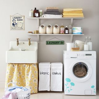 utility room with flower stickers on washing machine