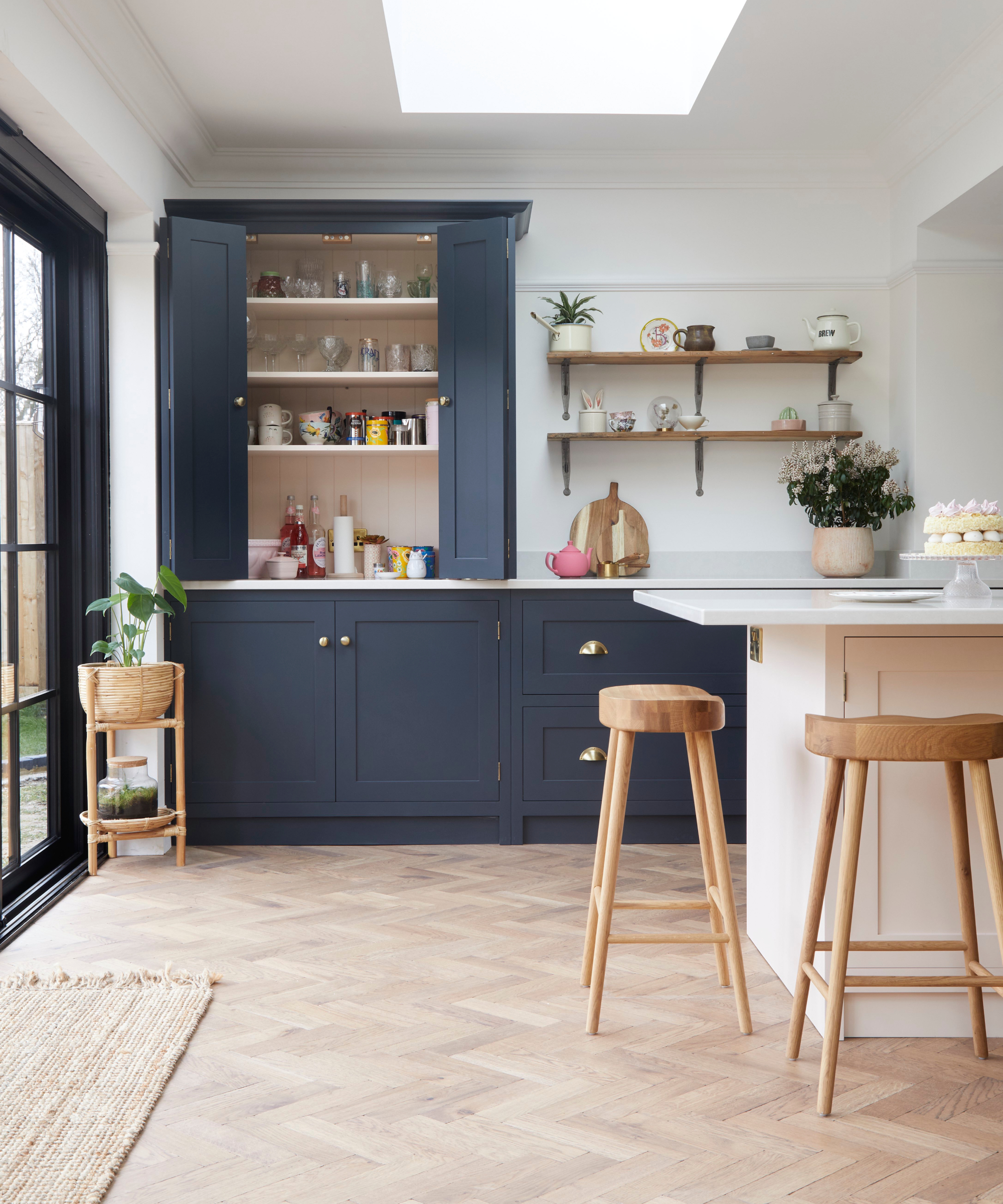 kitchen with tall units and undercounter cabinets painted wait