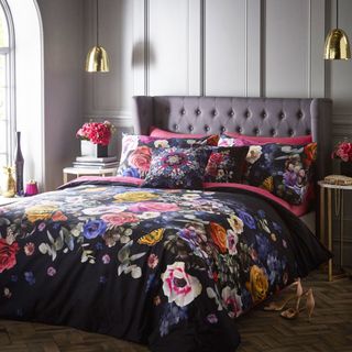 bedroom with bed cushions and florianna duvet set