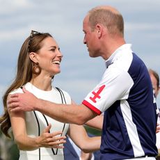 Prince William, Duke of Cambridge and Catherine, Duchess of Cambridge embrace after the Royal Charity Polo Cup 2022 at Guards Polo Club during the Outsourcing Inc. Royal Polo Cup at Guards Polo Club, Flemish Farm on July 06, 2022 in Windsor, England.