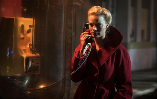 Margot Robbie on the phone in Terminal