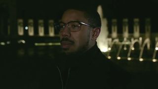 Michael B. Jordan stands pensively outside at night in Tom Clancy's Without Remorse.