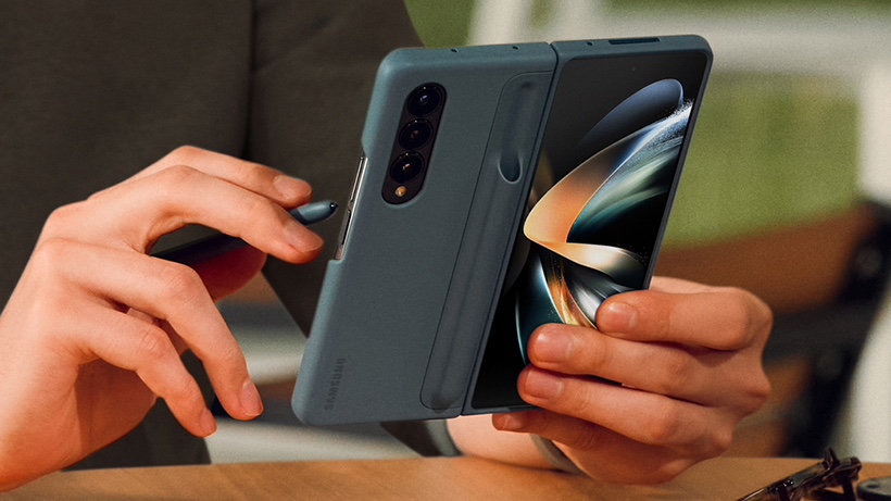 The samsung galaxy z Fold 4 in a case, held by someone using a stylus