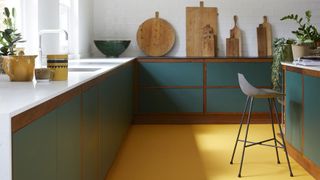 Yellow floor in a green kitchen