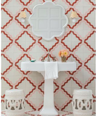 Playful bathroom scheme with pink and red ric rac patterned wall tiles