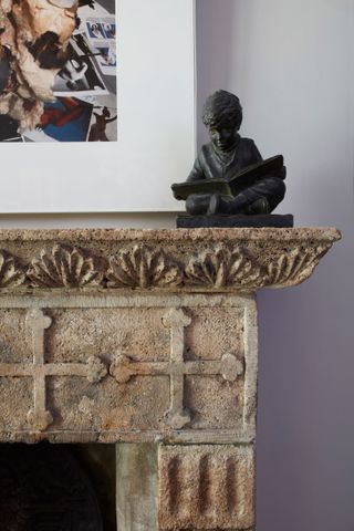 Stone fireplace with cross pattern and leaf texture