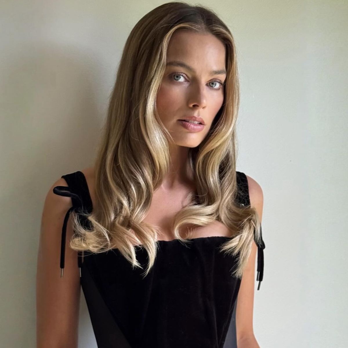 A photo of Margot Robbie with blonde highlights