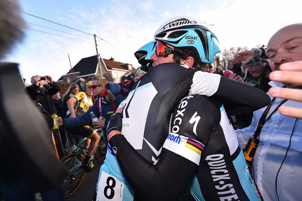 Cavendish gets a hug from a teammate following the race.