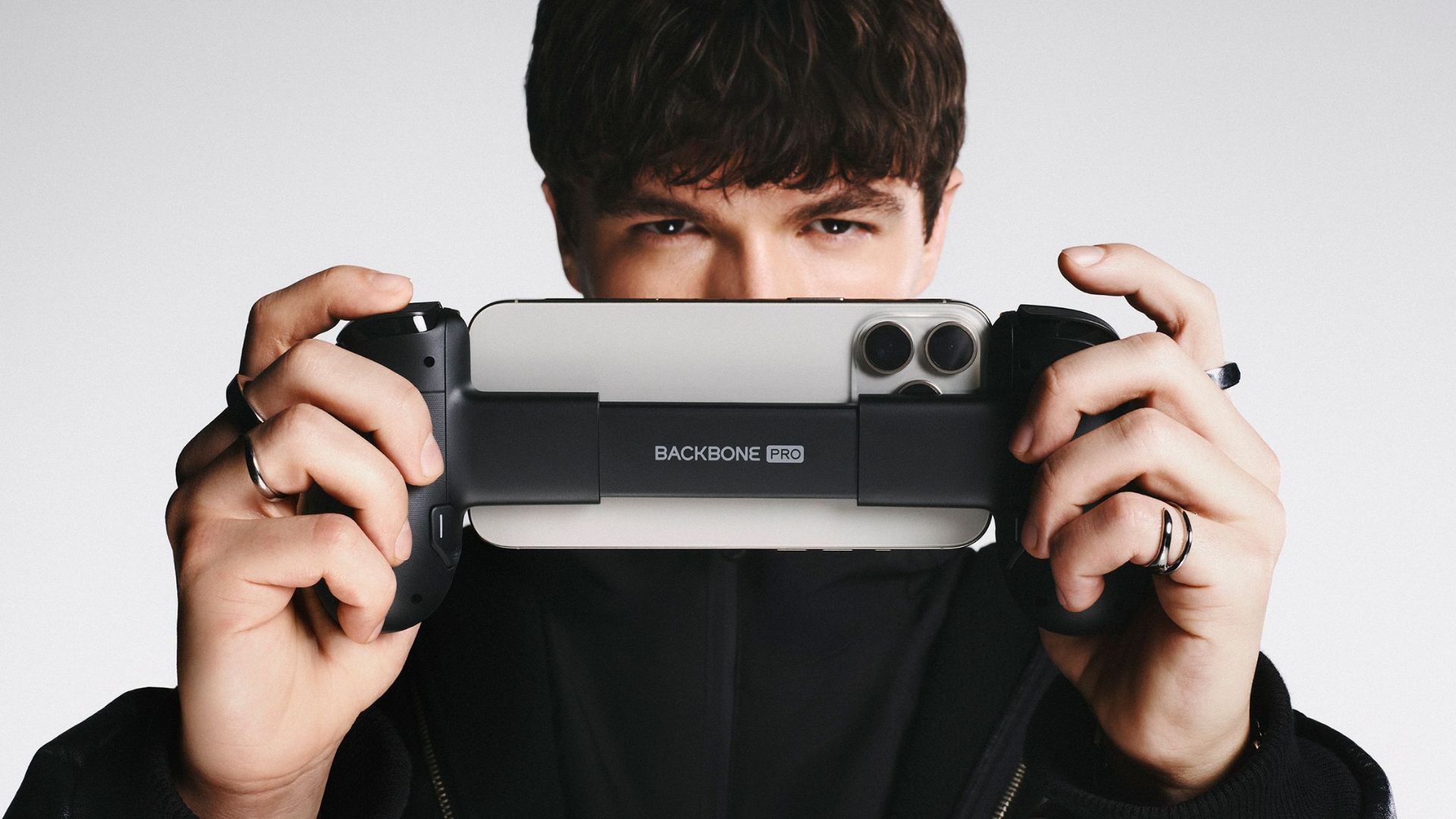 A lifestyle marketing image of the Backbone Pro being used by a man